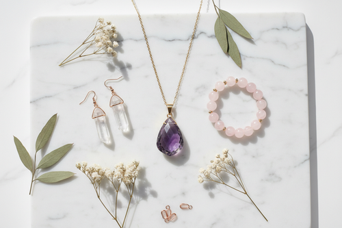 Crystal and gemstone jewellery set flat lay